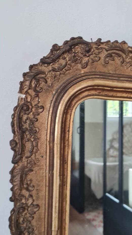 Antique Louis Philippe mirror with a pediment.
