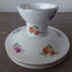 Old candle holder in flowered porcelain