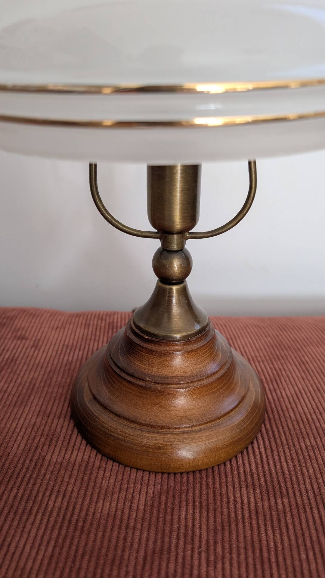 Vintage lamp made of turned wood, brass, and frosted glass.