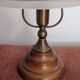 Vintage lamp made of turned wood, brass, and frosted glass.