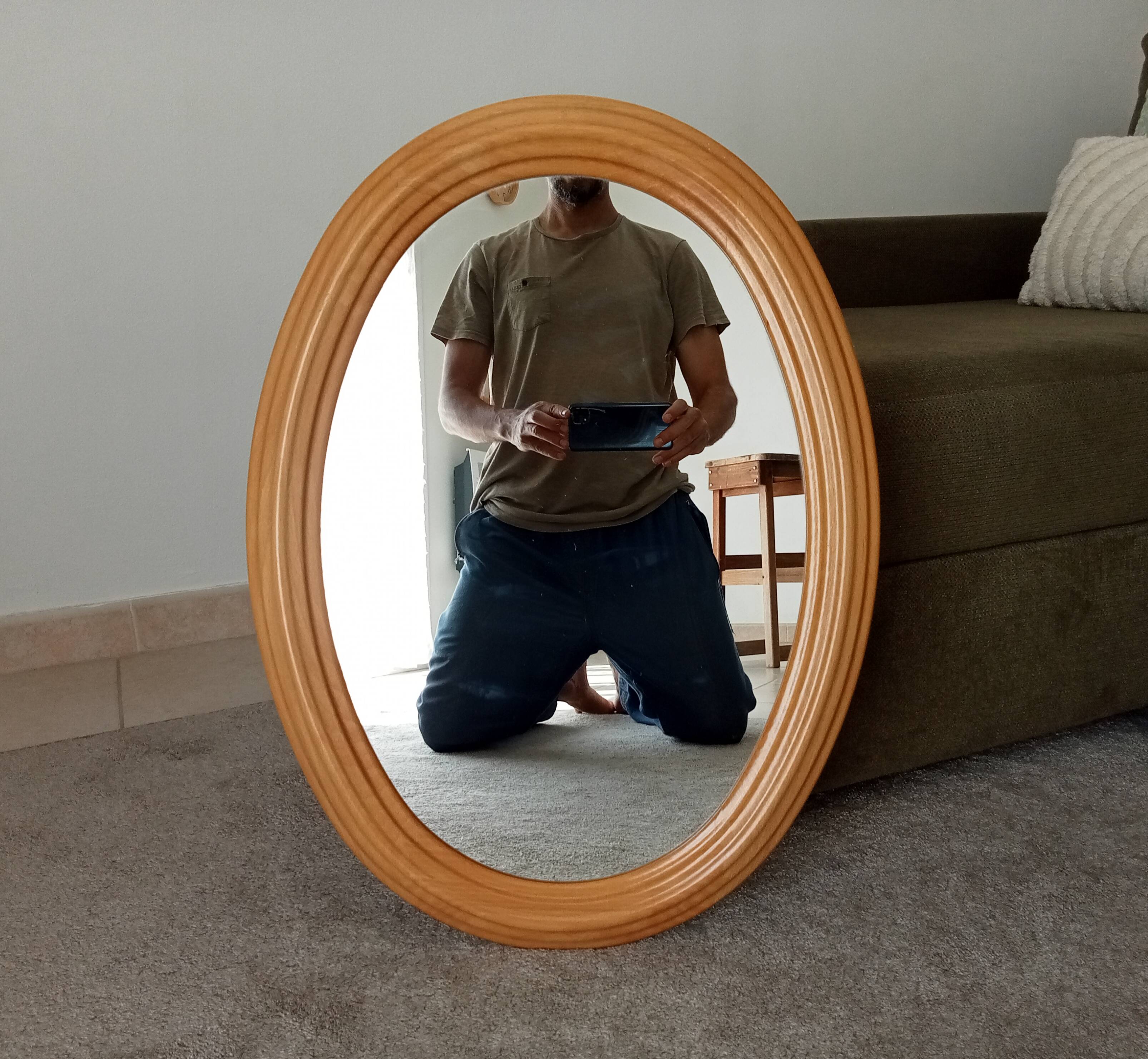 Vintage oval mirror in beech from the 70s/80s.