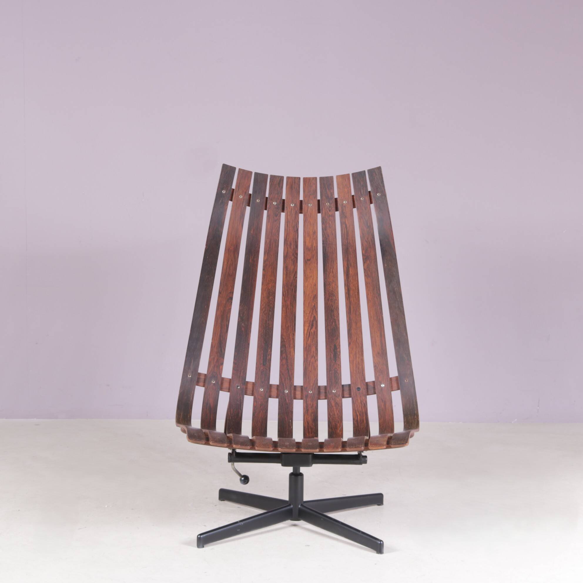 Lounge chair Rosewood with black metal cross base Hans Brattrud 1960s