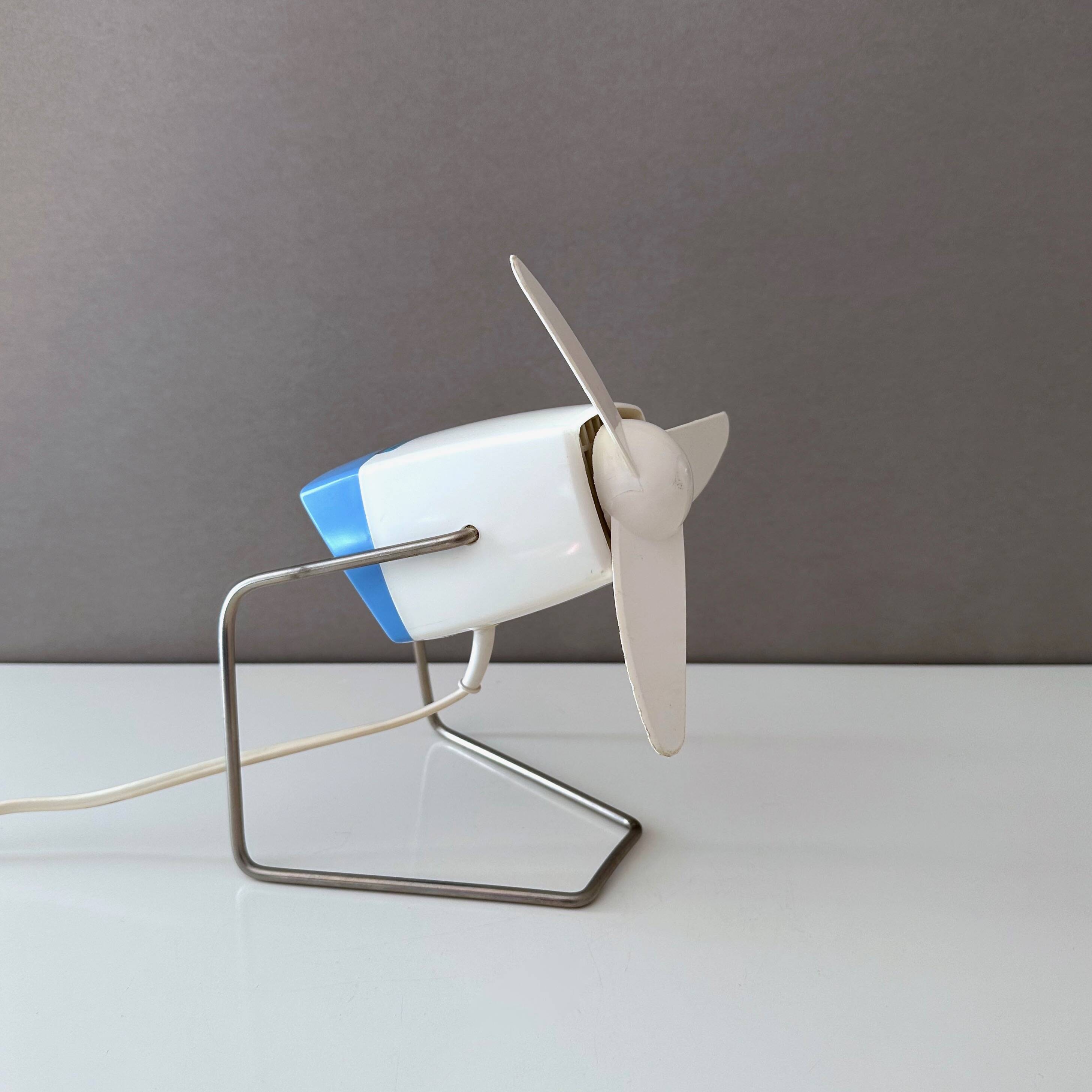 Blue Severin electric fan, mid-century office