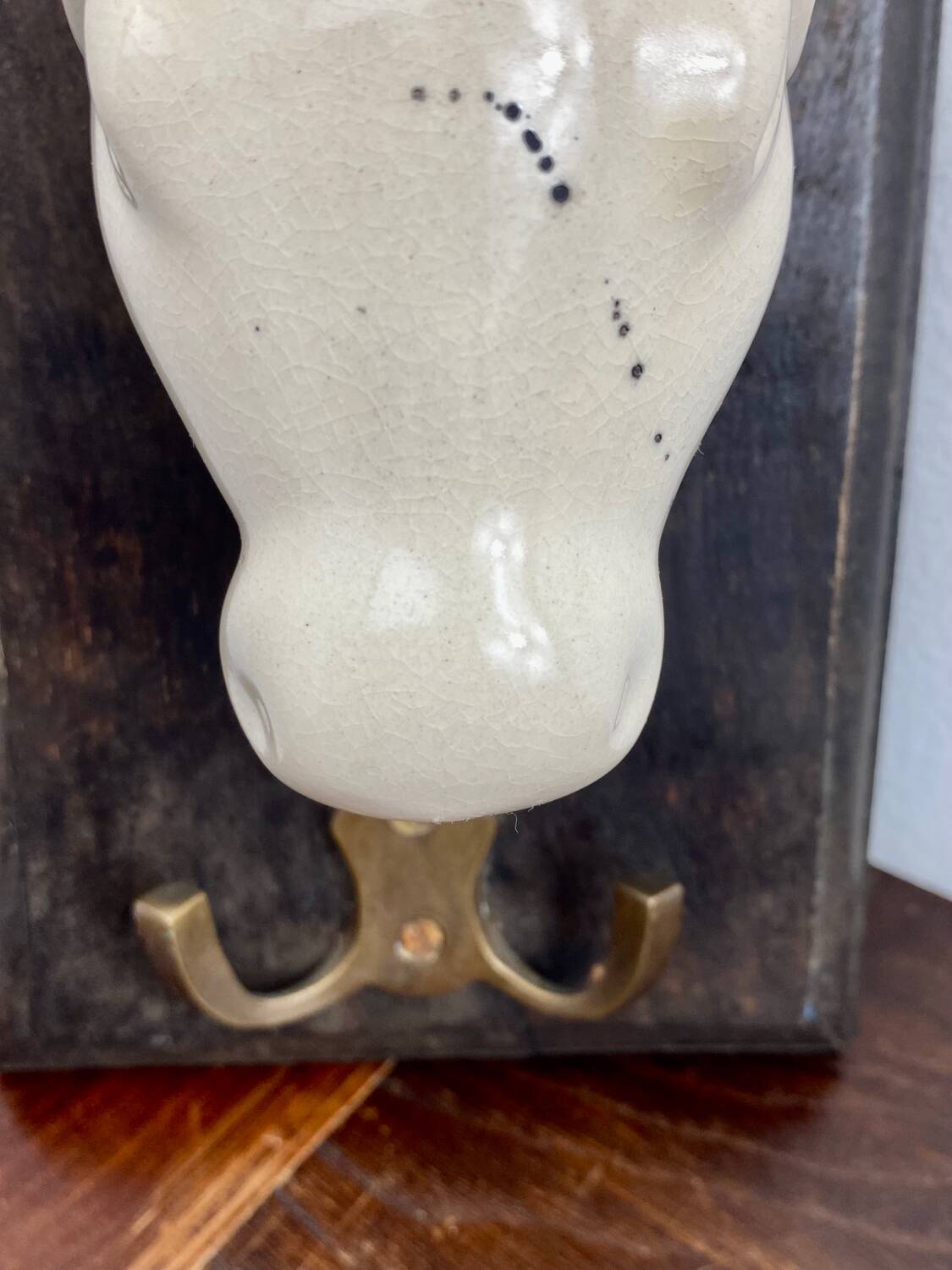 Old ceramic and wood coat hook