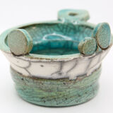 Atypical cup in turquoise and gray raku with signature
