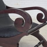 1970s, vintage armchair with footstool, black furniture leather.