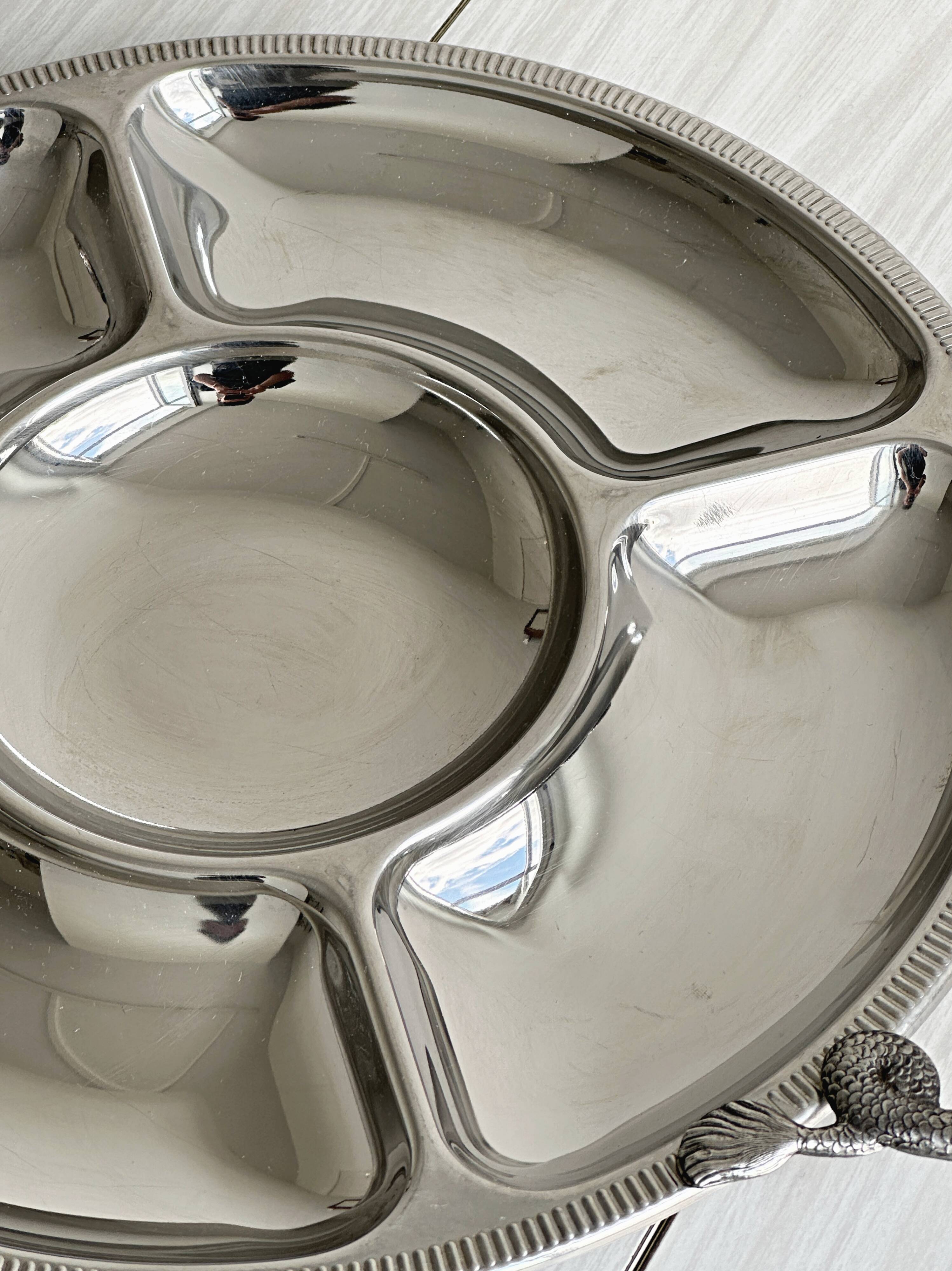 Vintage silver-plated metal serving tray with compartments.