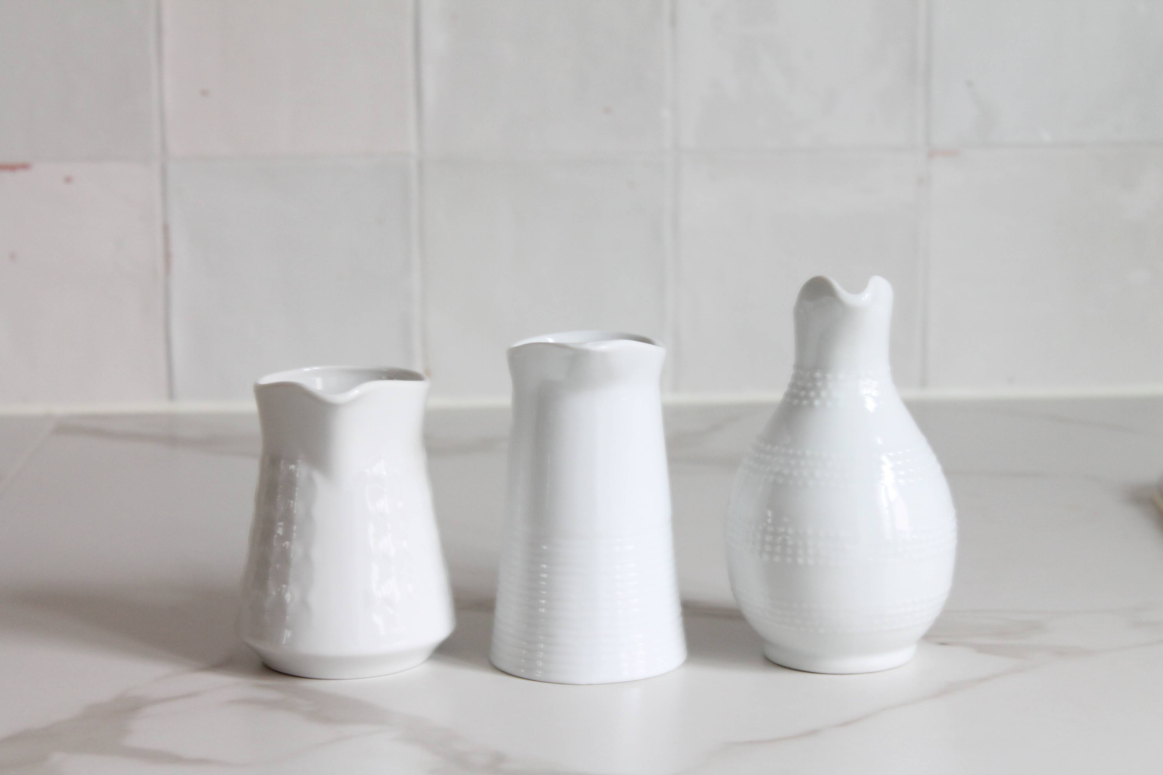 3 old French pitchers in white ceramic
