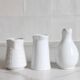 3 old French pitchers in white ceramic