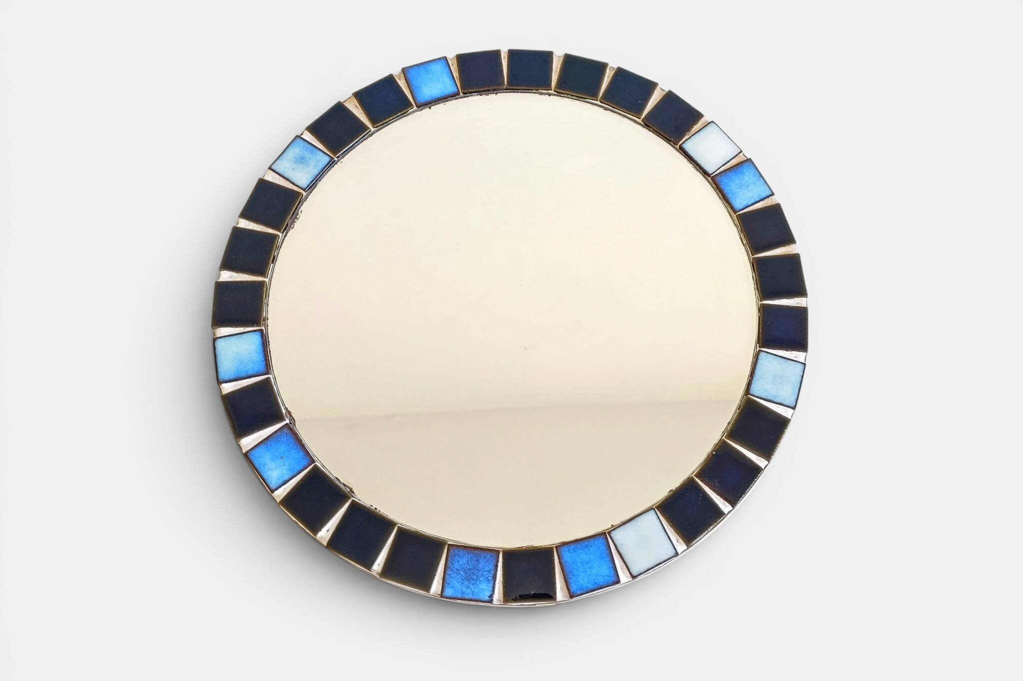 Round mosaic mirror in the style of Vallauris, France circa 1970.
