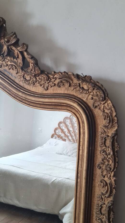 Antique Louis Philippe mirror with a pediment.