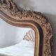 Antique Louis Philippe mirror with a pediment.