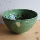 Large glazed ceramic salad bowl with a floral design.
