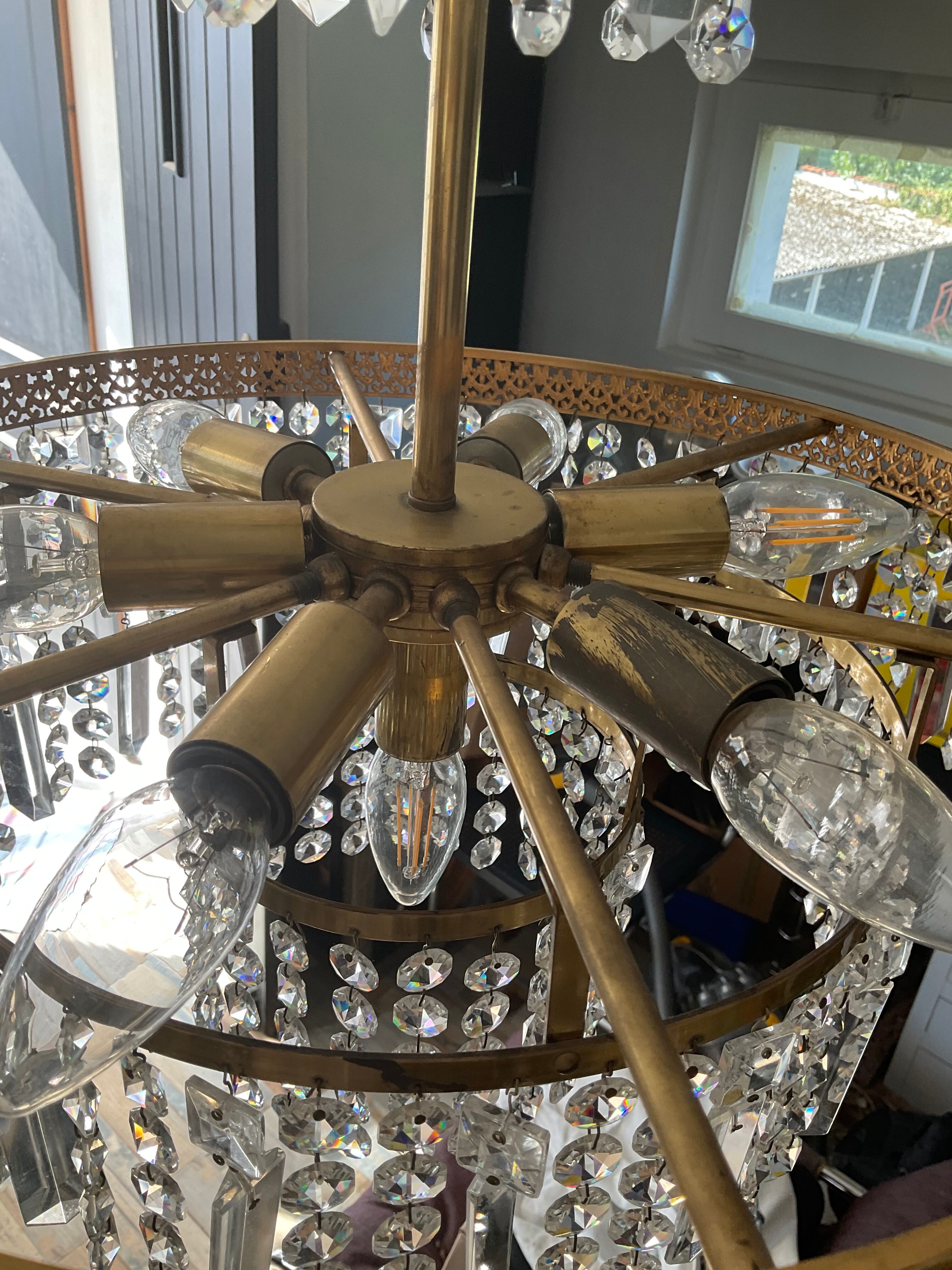 Old brass chandelier and crystal grapevines