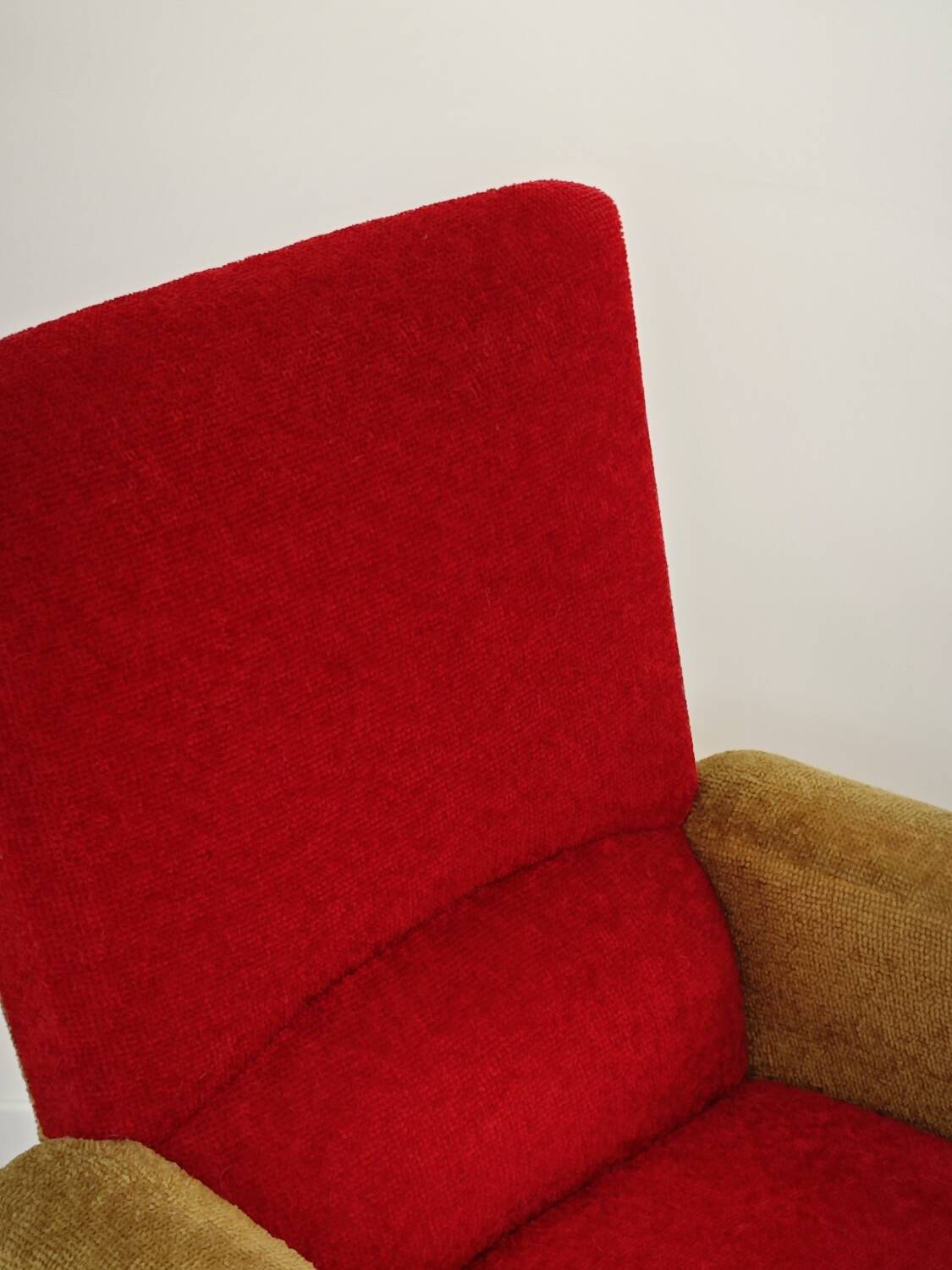 Red and mustard yellow fabric armchair in 1970s style