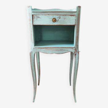Patinated bedside table end of sofa