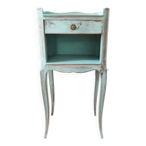 Patinated bedside table end of sofa