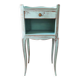 Patinated bedside table end of sofa