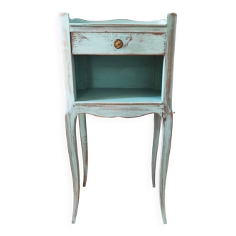 Patinated bedside table end of sofa