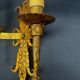 Pair of electrified golden wrought iron gothic wall sconces.