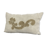 Cushion in vintage fabric with ornamentation