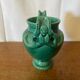 Antique green ceramic vase with handles