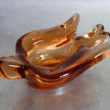 Old empty pocket/swallow ashtray in amber glass