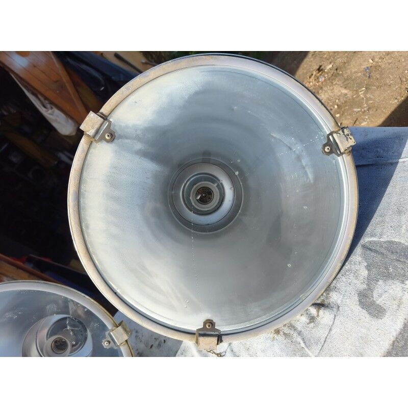Pair of industrial pendant lights in aluminium and glass.