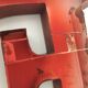 Red metal "F" sign letter