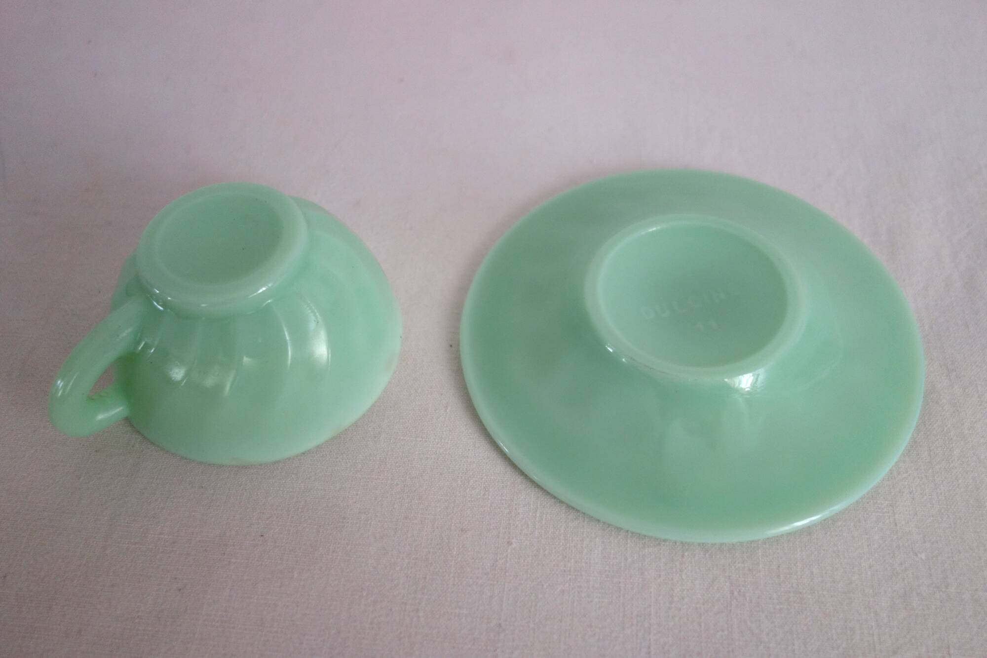 10 almond green opaline cups and saucers from the 50s