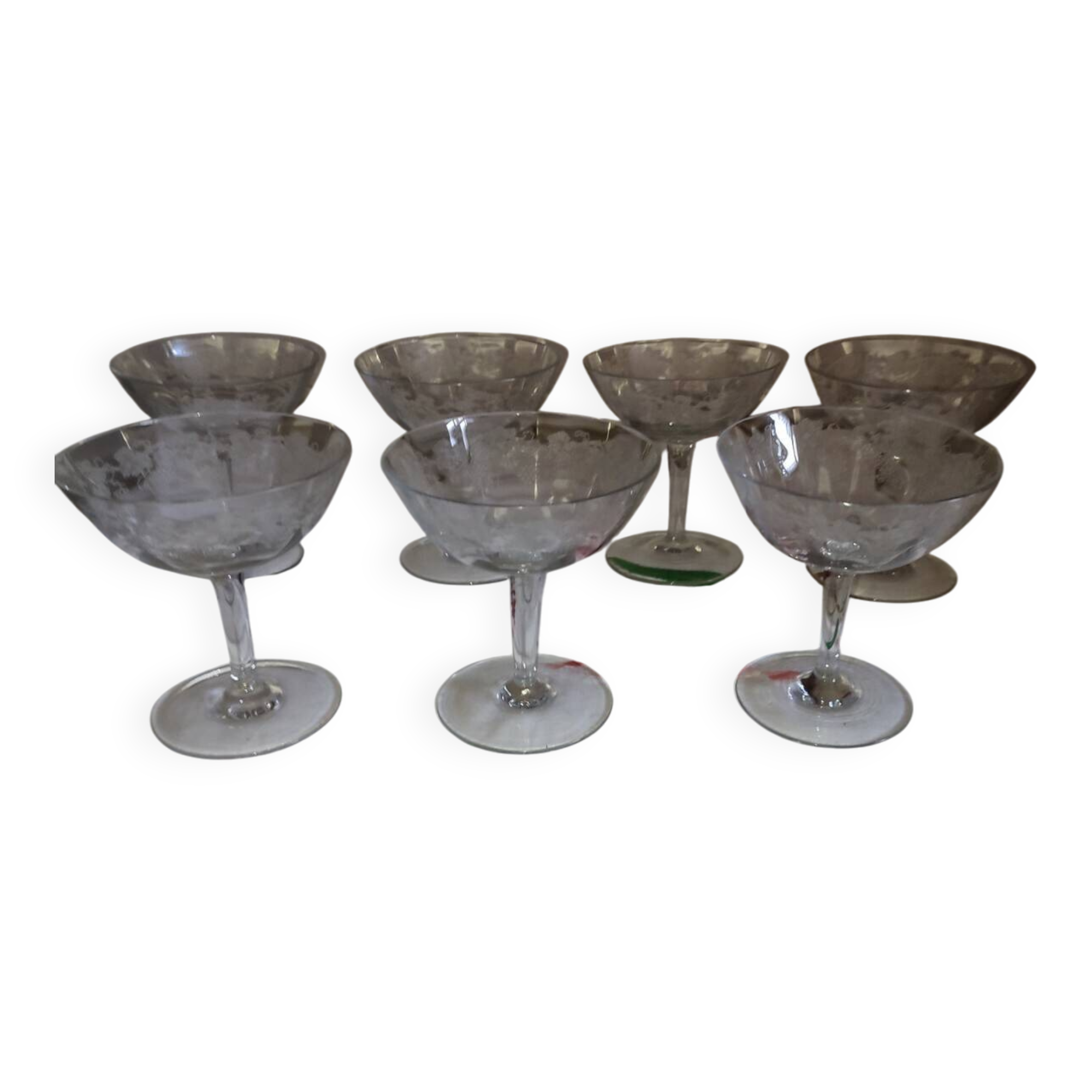 Beautiful set of seven crystal champagne glasses engraved with vine branches