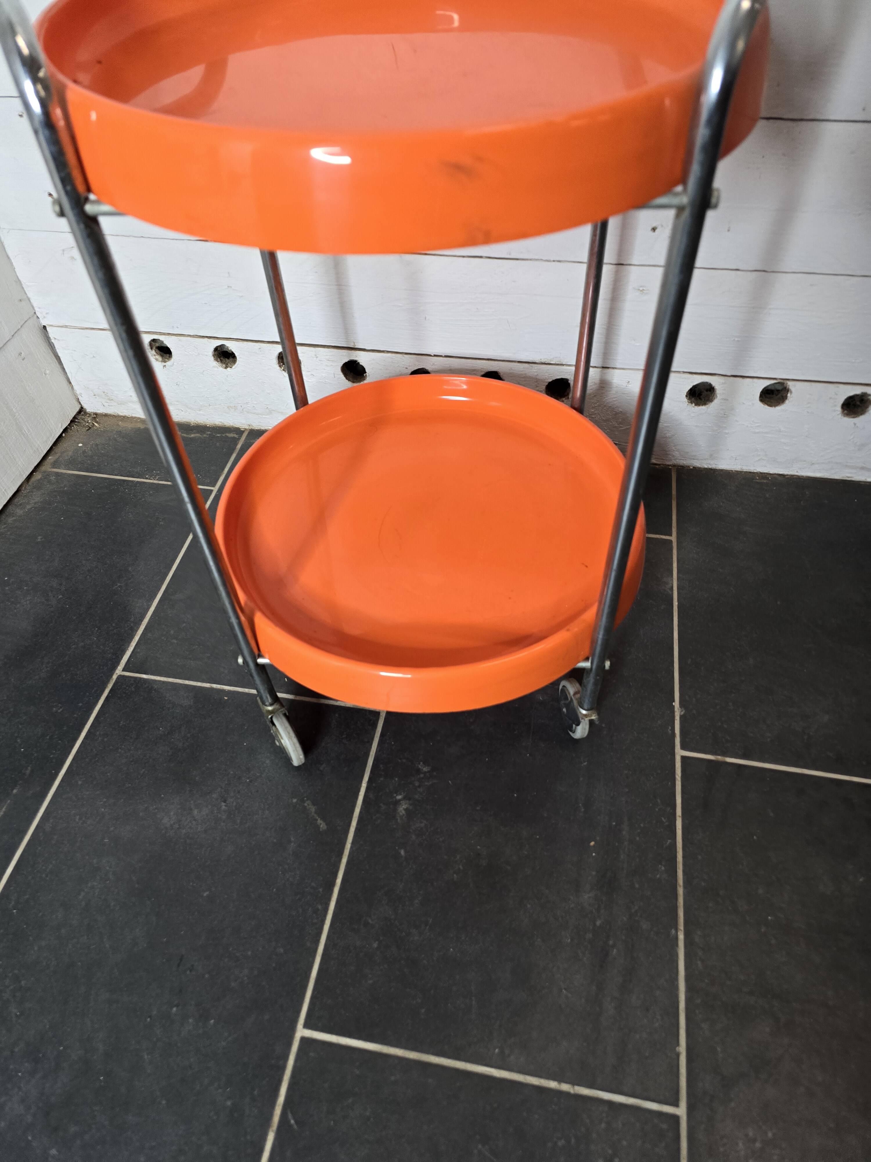 Orange trolley on wheels from the 70s