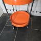 Orange trolley on wheels from the 70s