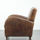 Sheepskin armchair in a light cognac colour with matching piping
