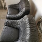 Pair of black leather armchairs from the 80s