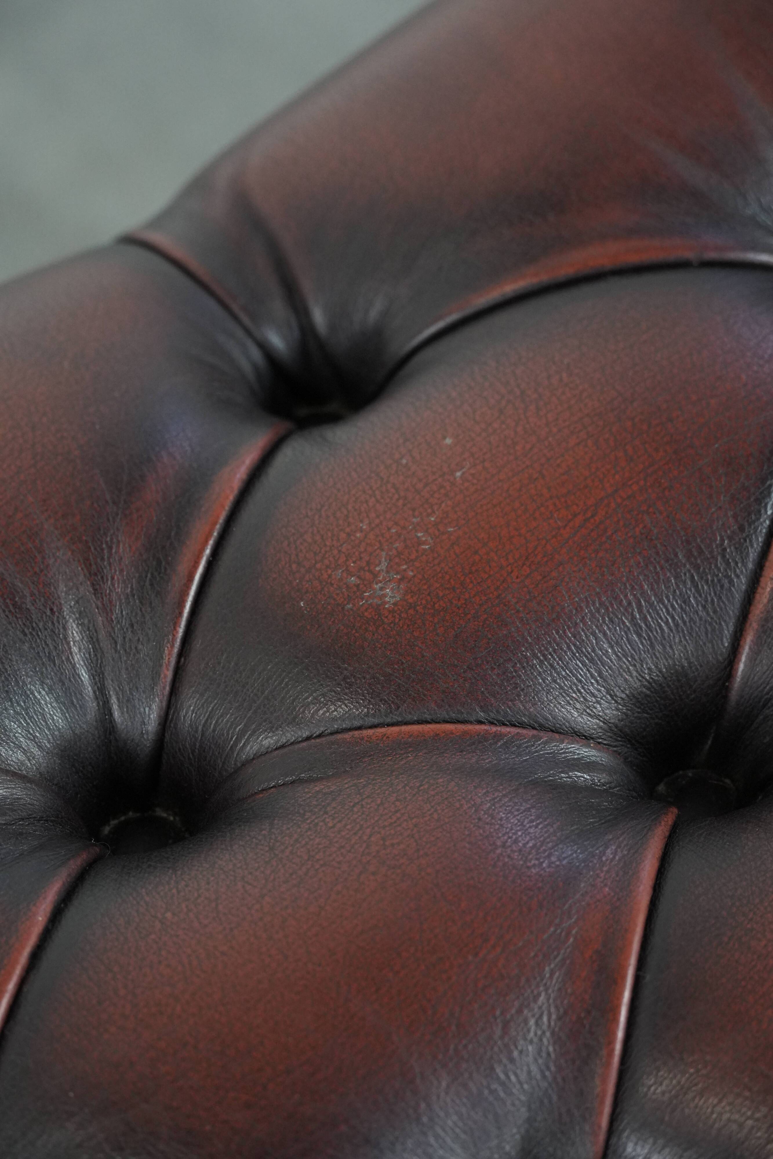 Dark brown chesterfield ottoman in cowhide leather