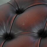 Dark brown chesterfield ottoman in cowhide leather