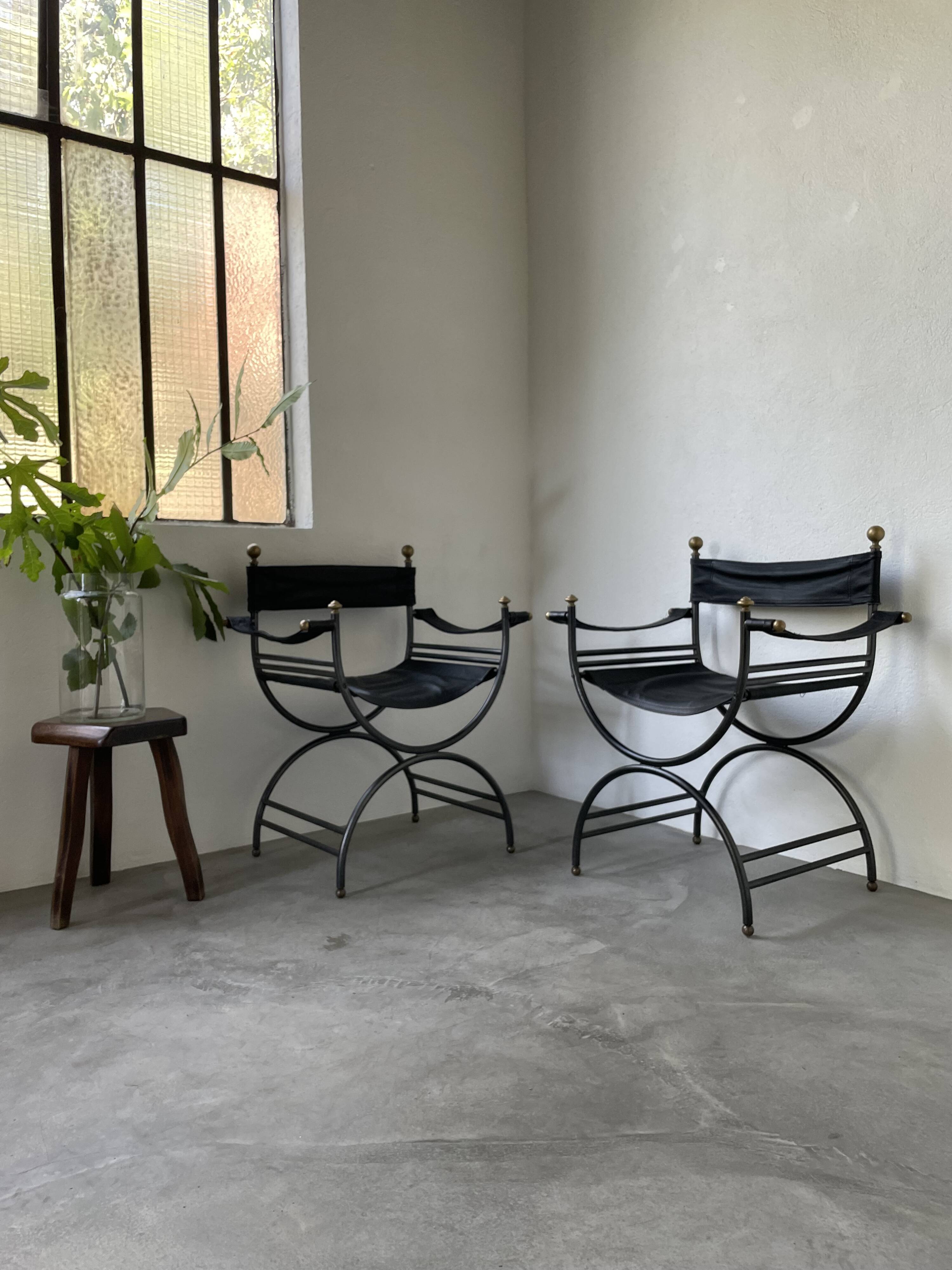 Pair of leather “curule” emperor armchairs