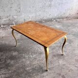 Vintage coffee table with gold-gilded legs and light brown wood veneer geometric inlaid top