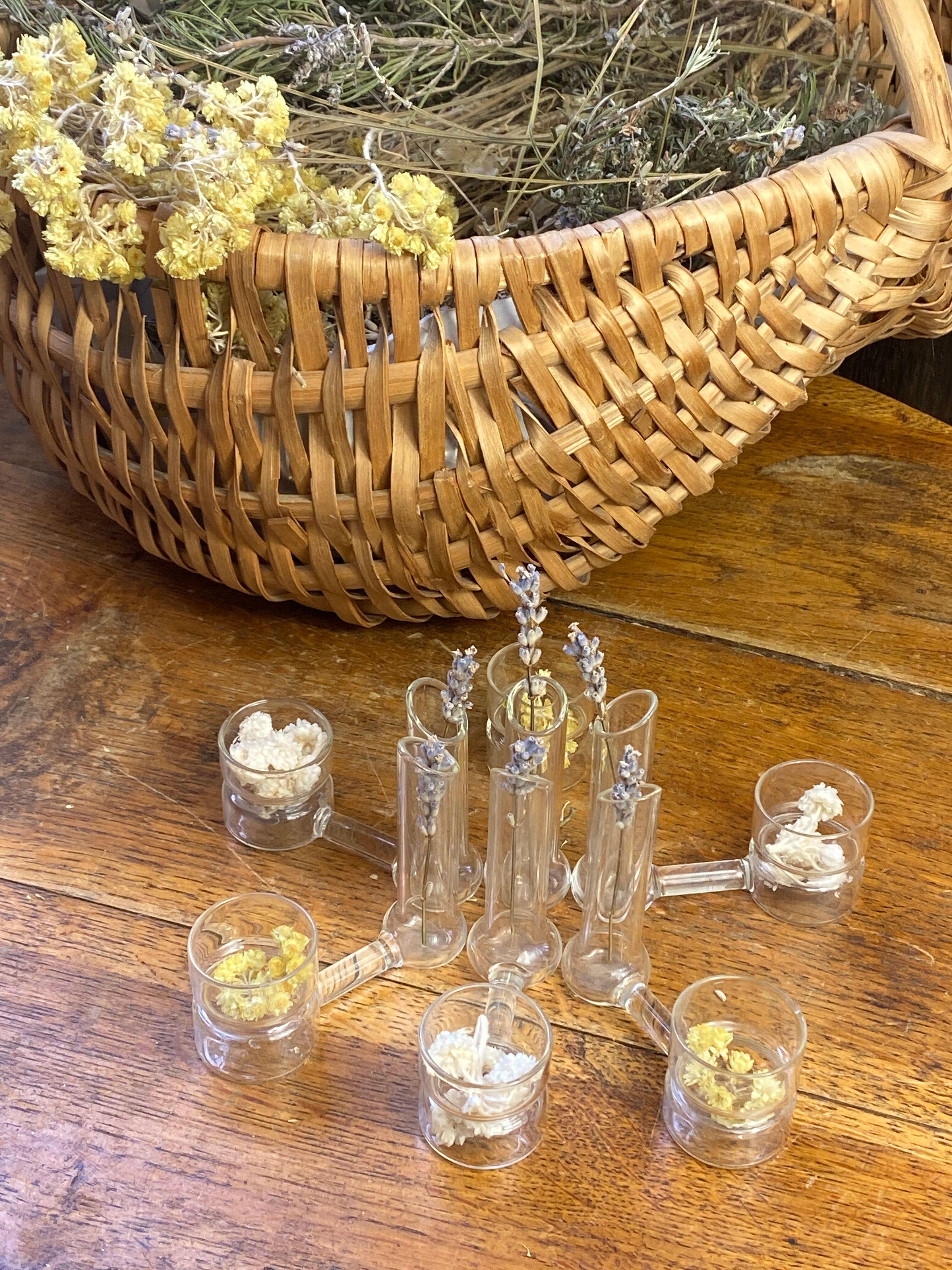 Knife rests, flower vases and candle holders in blown glass.