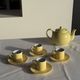 Set of 4 vintage yellow Italian espresso cups and saucers.