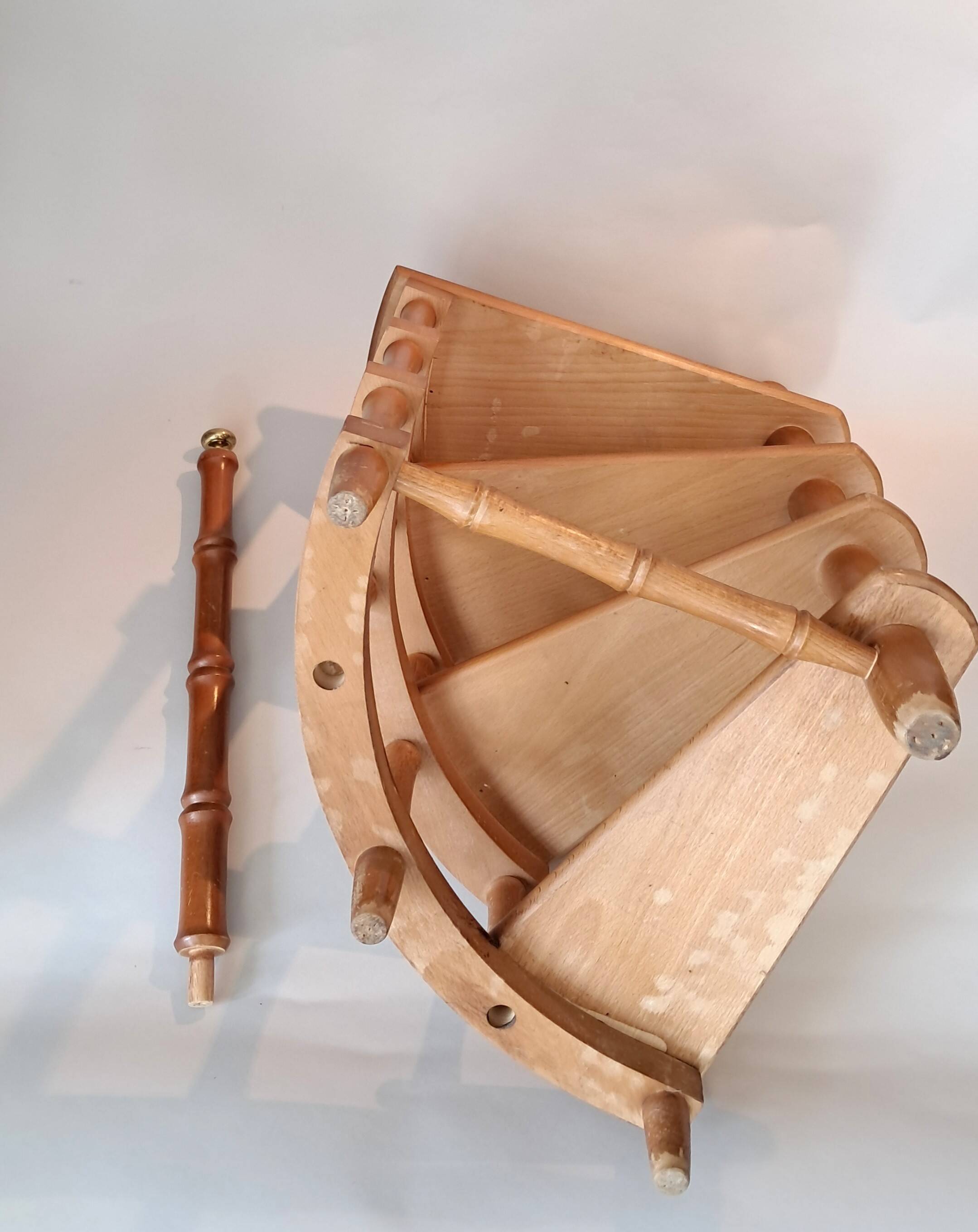 Library spiral staircase in beech and brown leather.