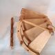 Library spiral staircase in beech and brown leather.