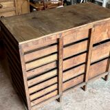 Craftsman's cabinet with 16 drawers in dark wood.