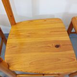 Suite of a round table with extension and 4 vintage pine chairs from the 60s and 70s