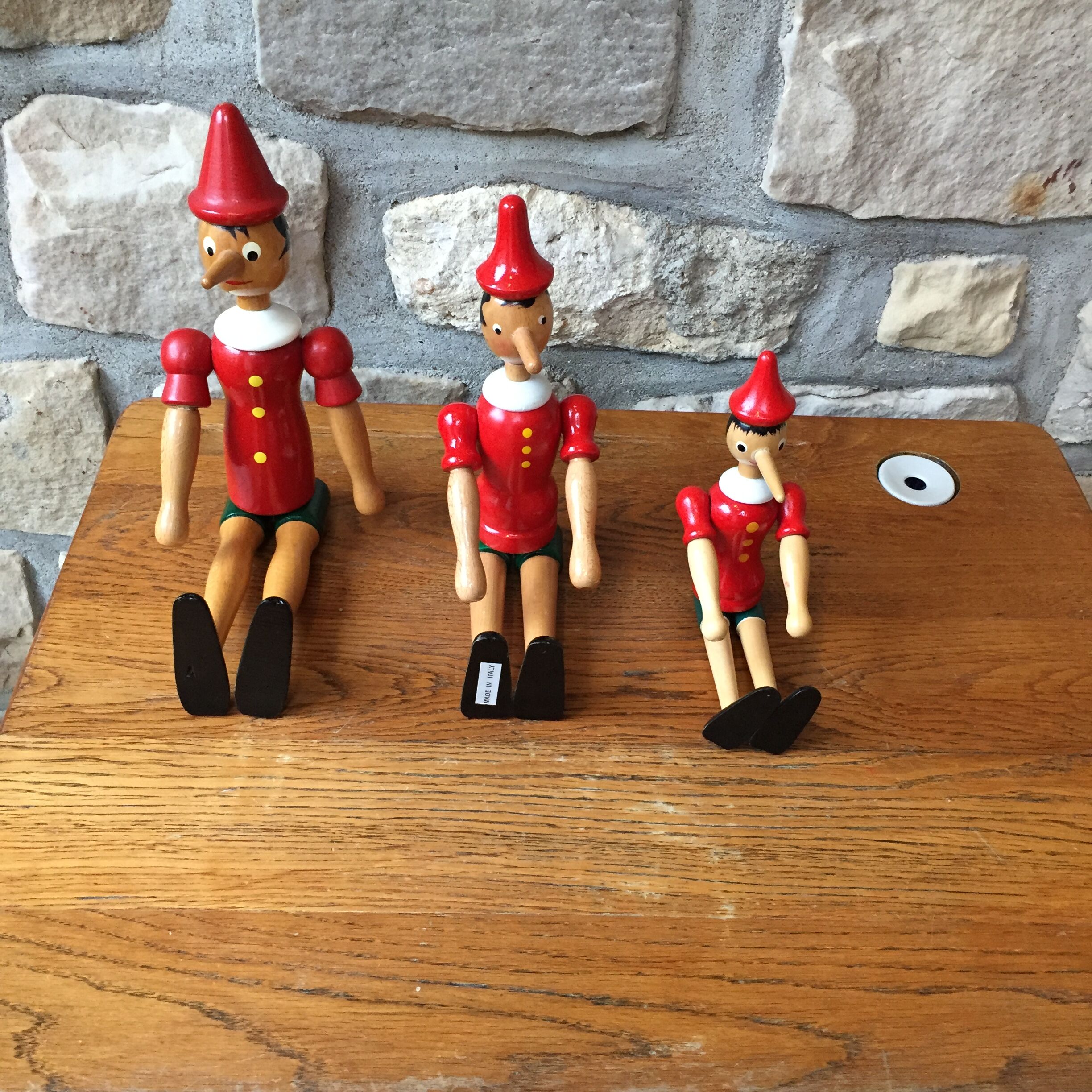 Trio of old wooden Pinocchio Made in Italy