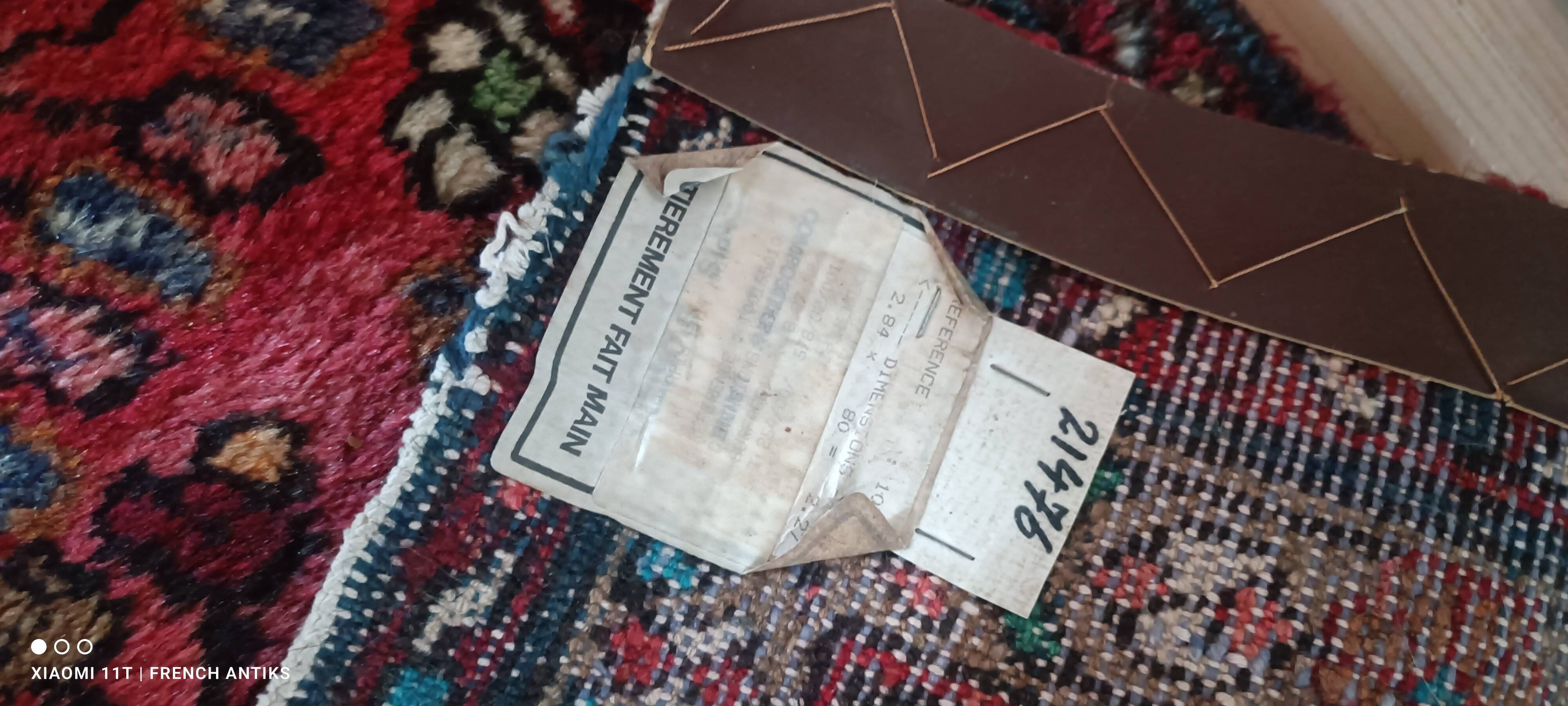 Vintage oriental rug from the 1930s. Handcrafted, handmade. Worn.