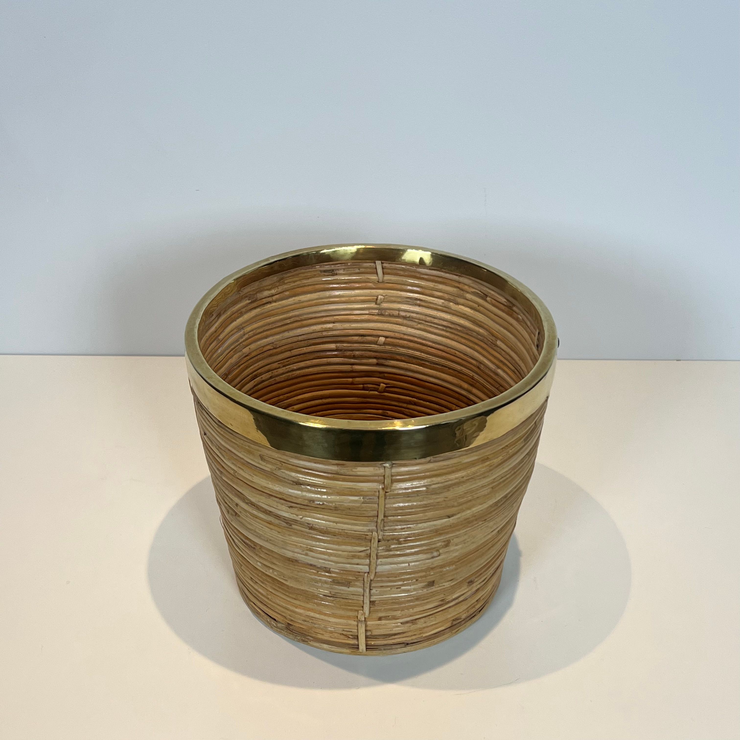Rattan and brass wastepaper basket in the style of Gabriela Crespi.