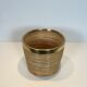Rattan and brass wastepaper basket in the style of Gabriela Crespi.