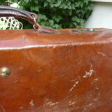 Old monogrammed leather travel suitcase and barony crown